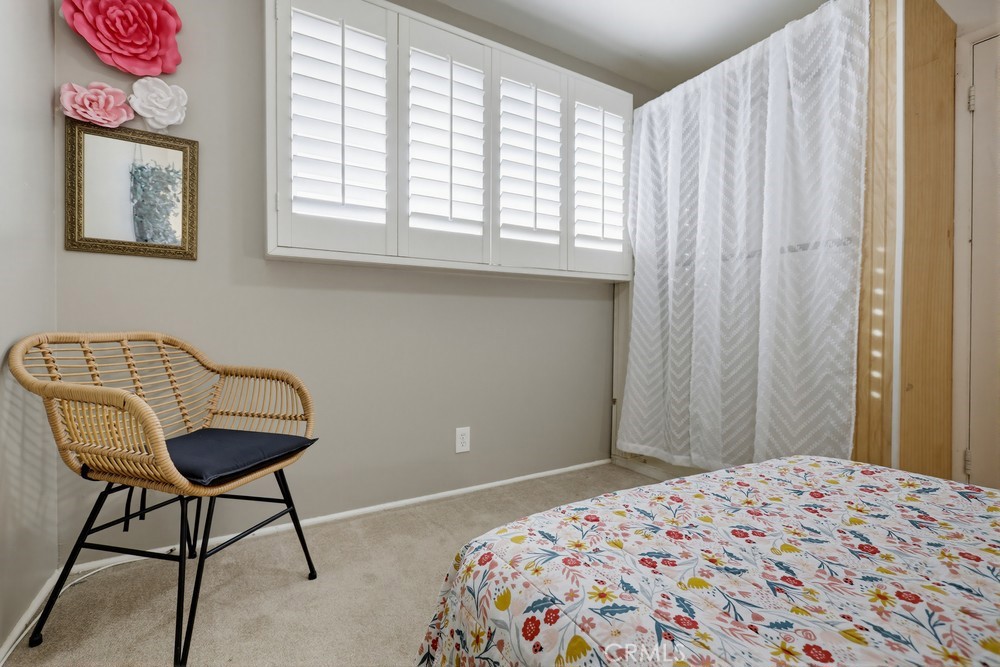 11681 Wasco Road Garden Grove, CA 92841 - Photo 37 of 58 a bedroom with a bed and a window