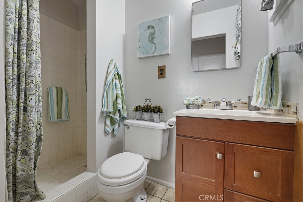 11681 Wasco Road Garden Grove, CA 92841 - Photo 43 of 58 a bathroom with a sink toilet and shower
