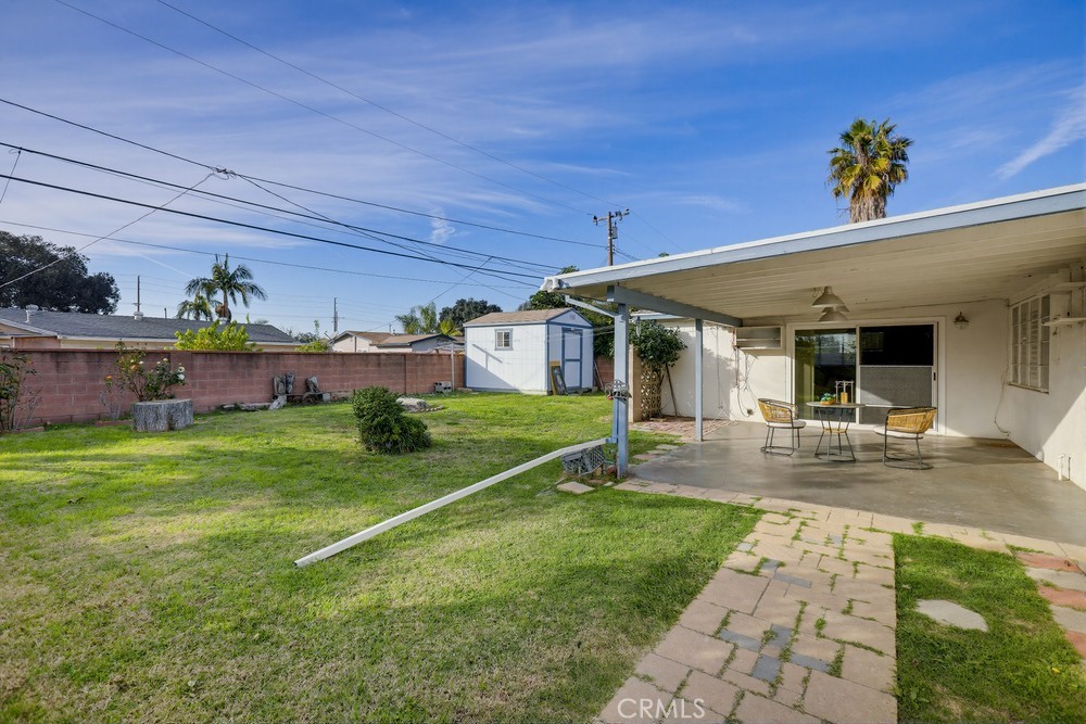 11681 Wasco Road Garden Grove, CA 92841 - Photo 48 of 58 a view of a house and chair and table in the patio