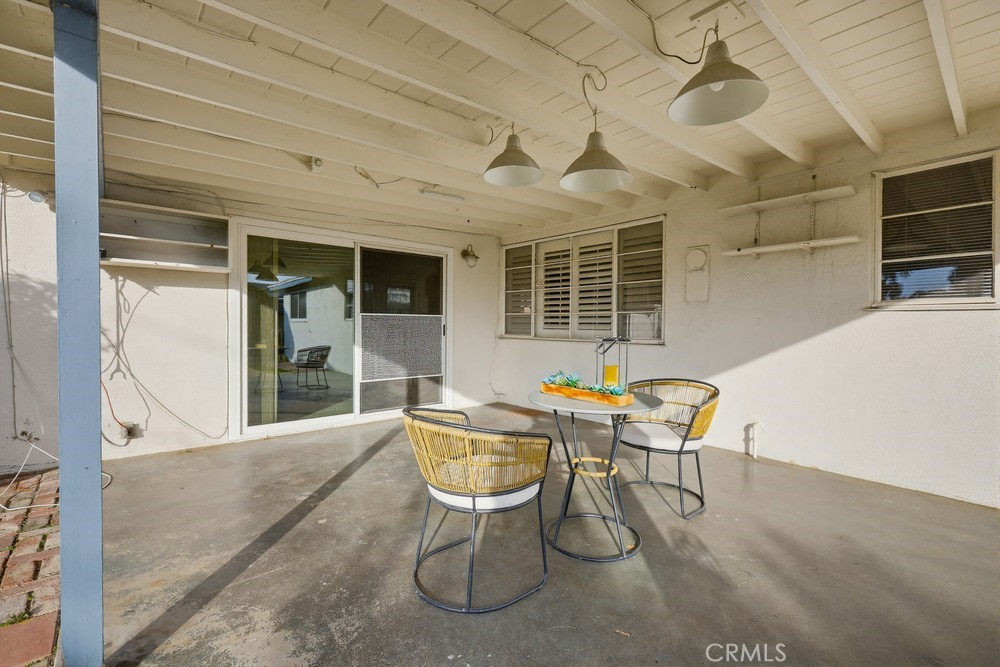 11681 Wasco Road Garden Grove, CA 92841 - Photo 55 of 58 a view of a patio with table and chairs and potted plants