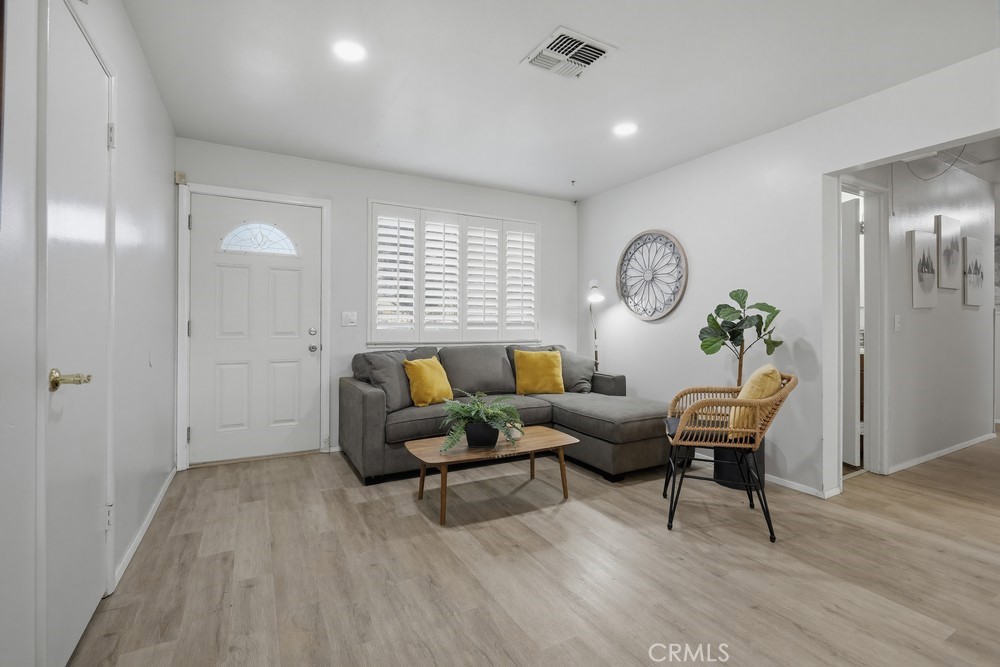 11681 Wasco Road Garden Grove, CA 92841 - Photo 7 of 58 a living room with furniture a window and wooden floor