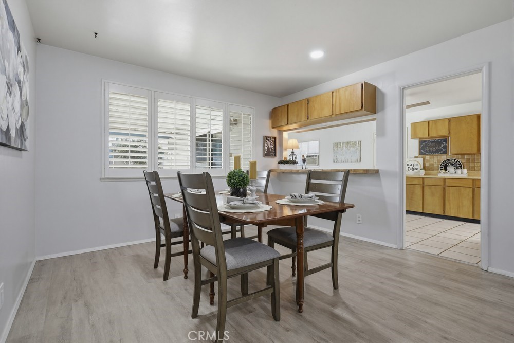 11681 Wasco Road Garden Grove, CA 92841 - Photo 10 of 58 a view of a dining room with furniture window and wooden floor