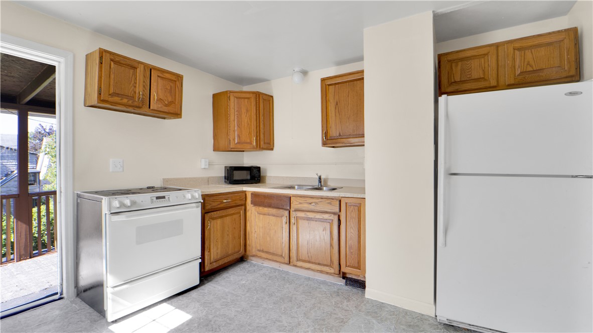 71 Crombie Street Rochester, NY 14605 - Photo 7 of 17 Upper Unit Kitchen with view of private balcony.
