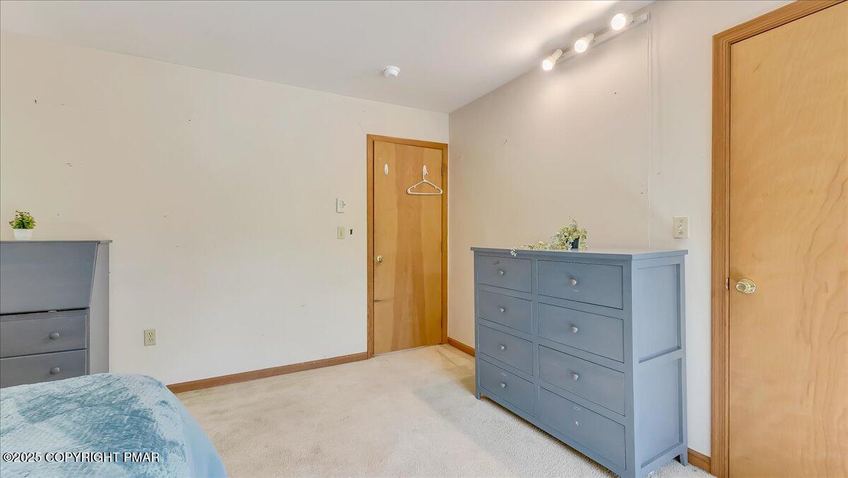 74 Split Rock Road Lake Harmony, PA 18624 - Photo 32 of 77 a room with a bed and a dresser