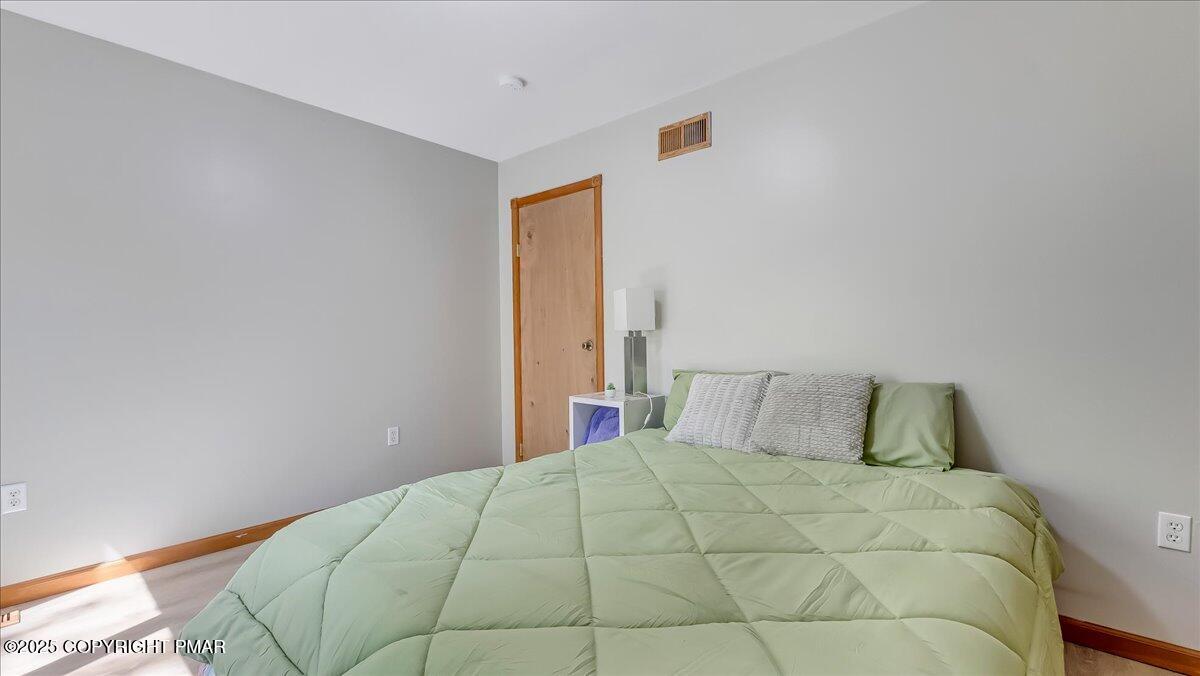 74 Split Rock Road Lake Harmony, PA 18624 - Photo 44 of 77 a bedroom with a bed and a window