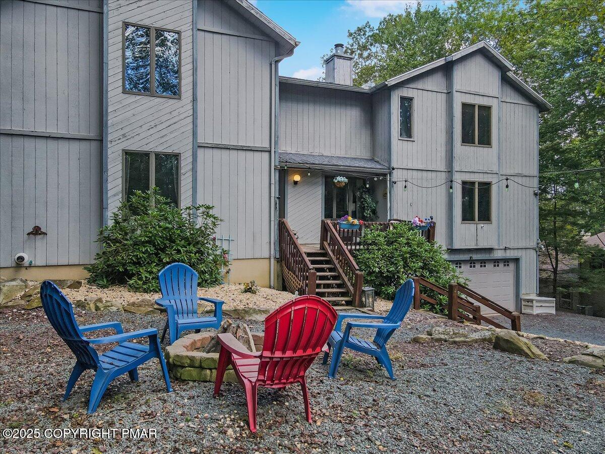 74 Split Rock Road Lake Harmony, PA 18624 - Photo 60 of 77 a view of a house with backyard and sitting area