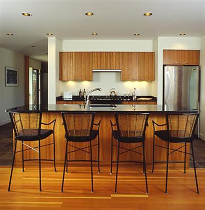6 Cooper Circle Truro, MA 02666 - Photo 7 of 24 a kitchen with a table chairs refrigerator and cabinets
