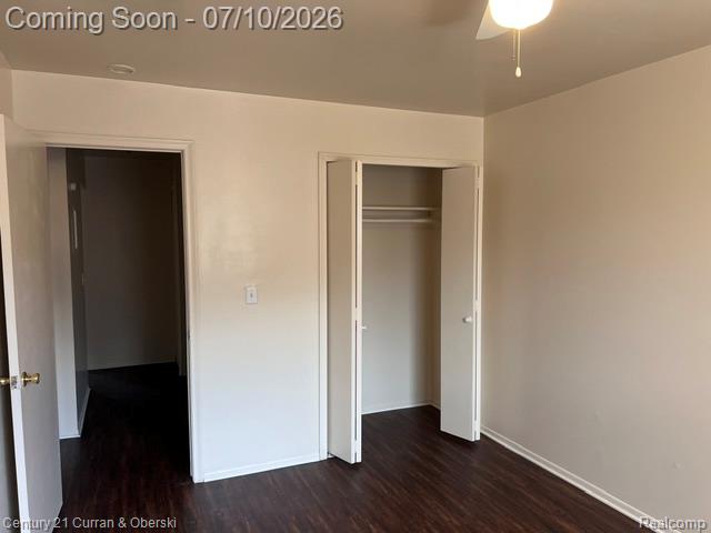 14682 Middle Gibraltar Road, Unit 24 Rockwood, MI 48173 - Photo 20 of 21 Interior room featuring dark wood-finish flooring, light-colored walls, and white trim