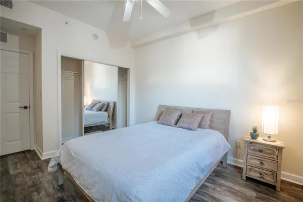 a bed room with a bed and a chair