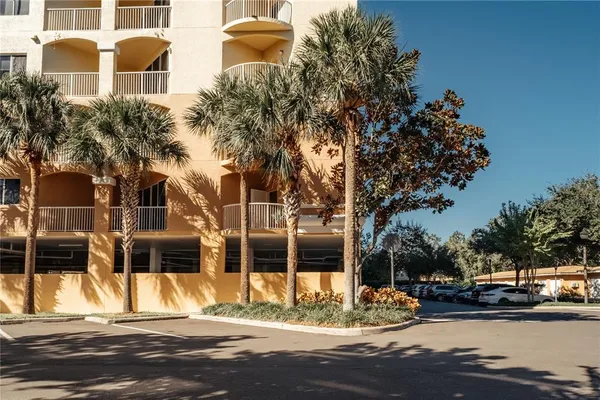 a view of a street with cars parked