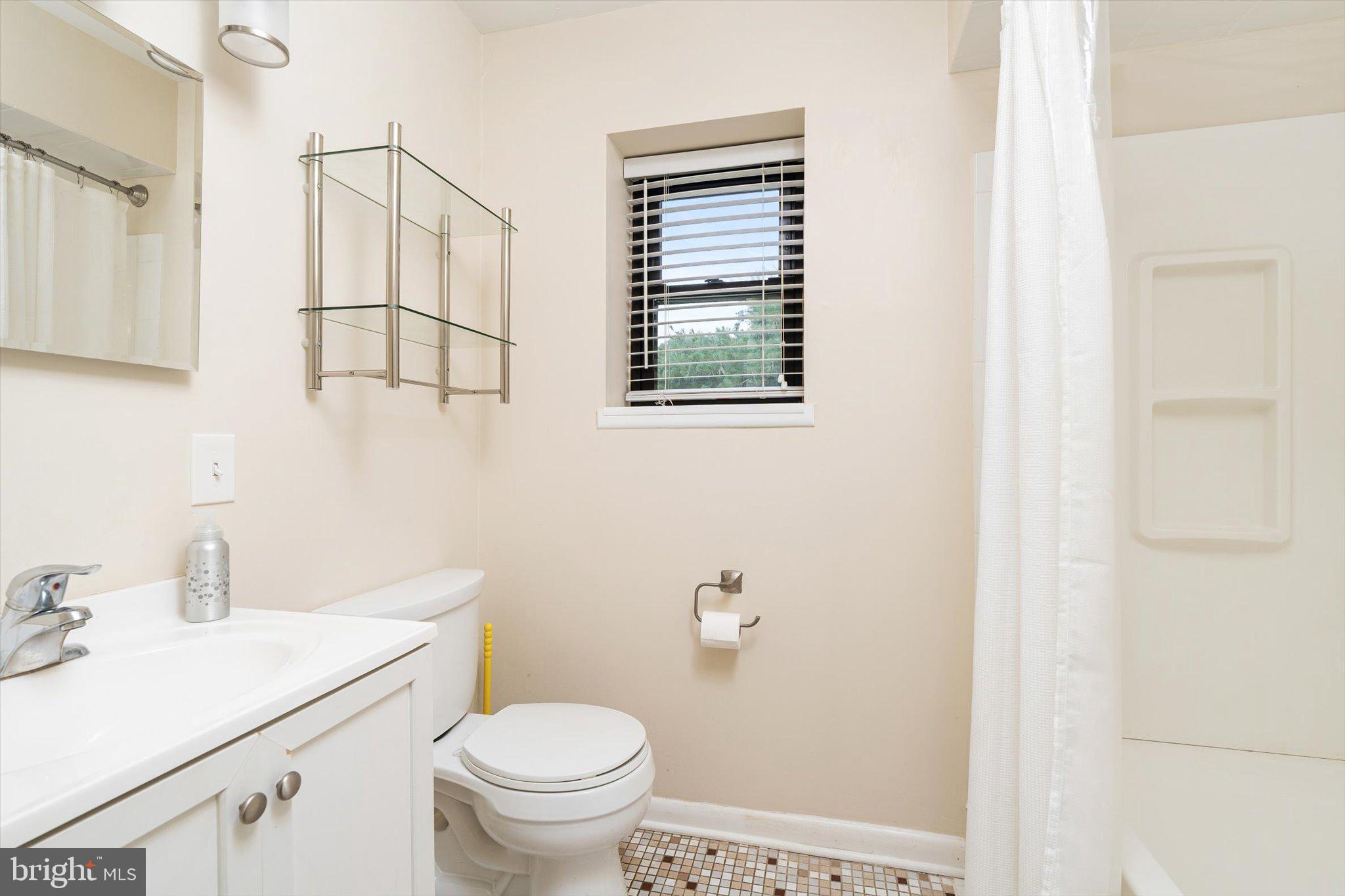 201 Silver Court Hamilton, NJ 08690 - Photo 13 of 27 a bathroom with a sink toilet and vanity