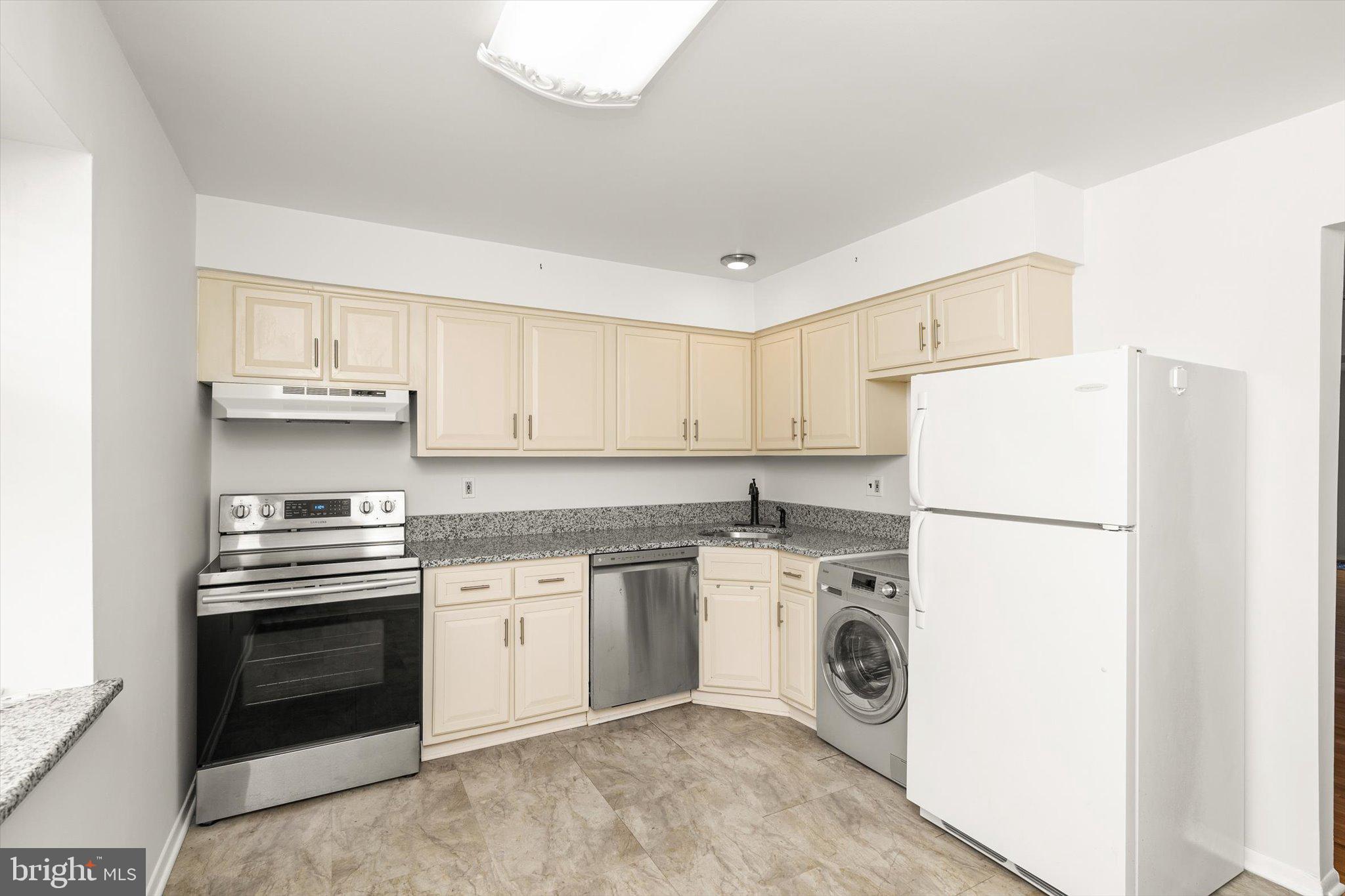 201 Silver Court Hamilton, NJ 08690 - Photo 17 of 27 a kitchen with a stove top oven and sink