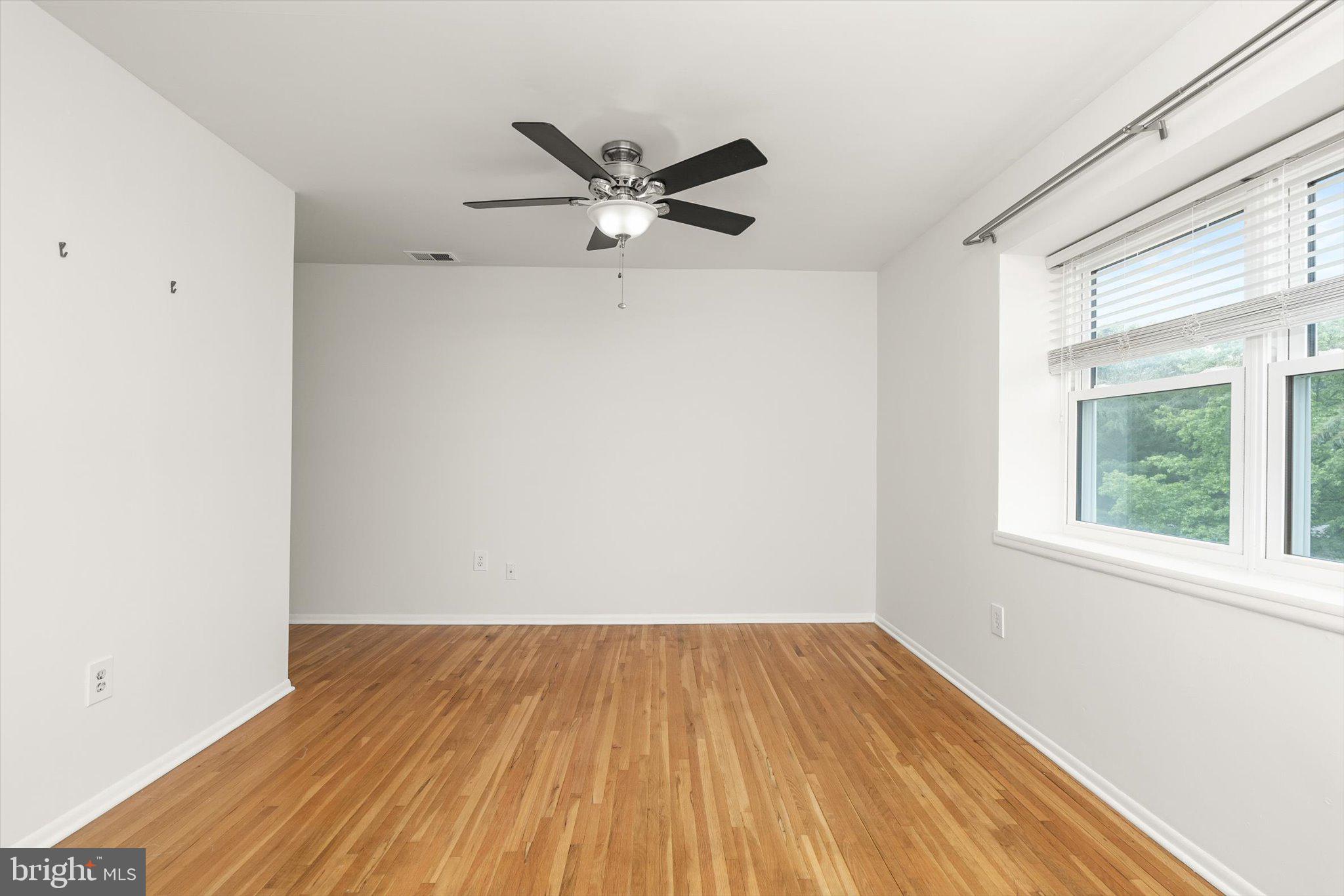 201 Silver Court Hamilton, NJ 08690 - Photo 7 of 27 a view of a room with wooden floor and a window