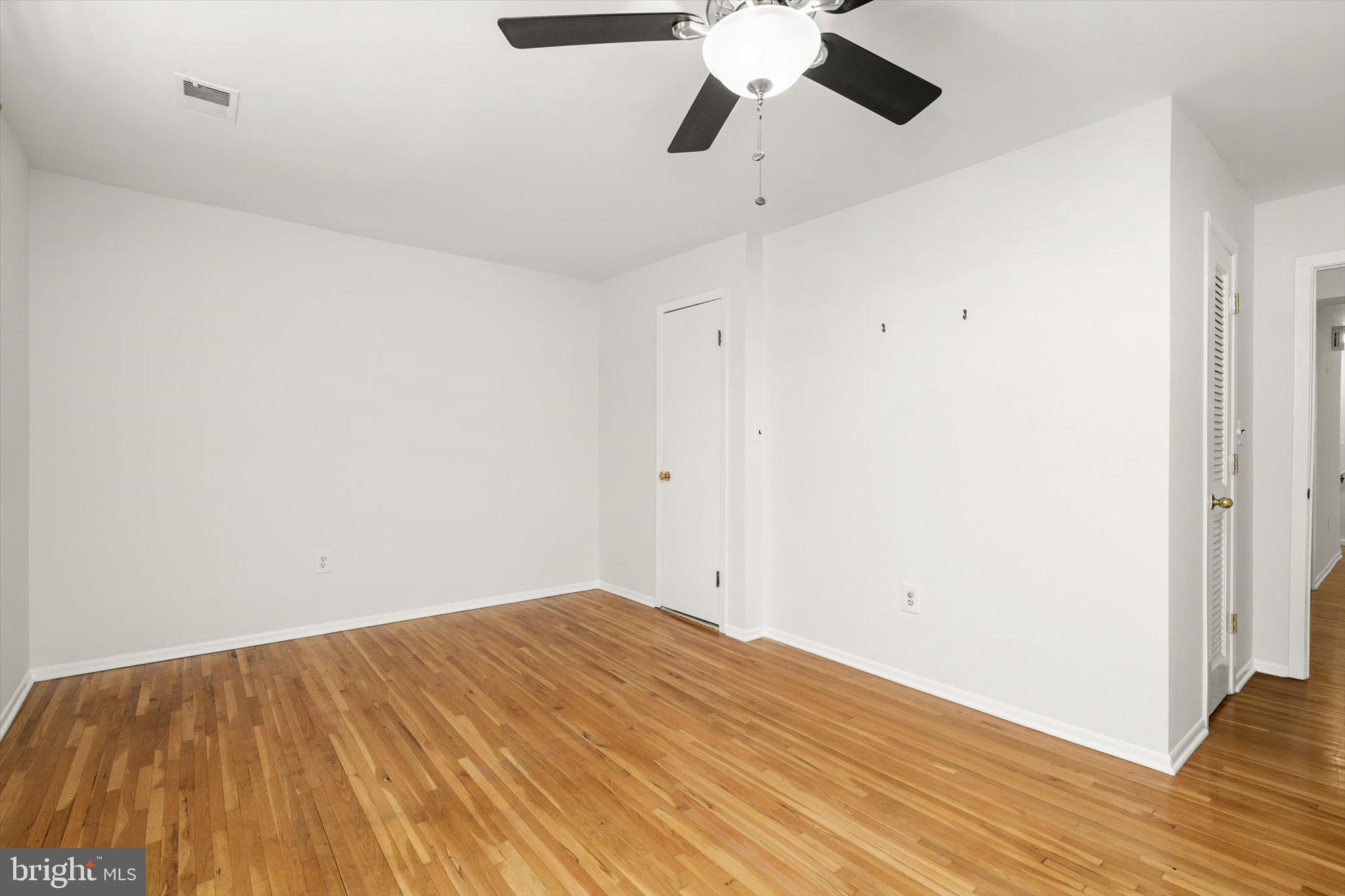 201 Silver Court Hamilton, NJ 08690 - Photo 8 of 27 a view of empty room with wooden floor