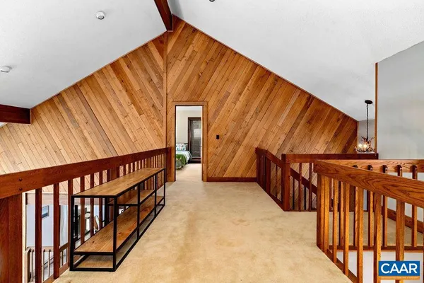 a bedroom with a bed and a dresser in it