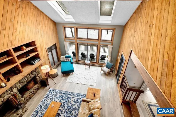 a view of a workspace with furniture and a bathroom