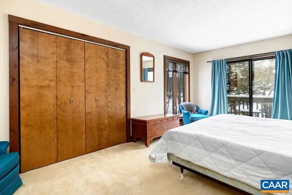 a view of a swimming pool with an outdoor space and seating area