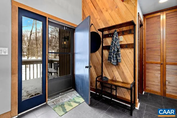 a view of living room with furniture and a rug