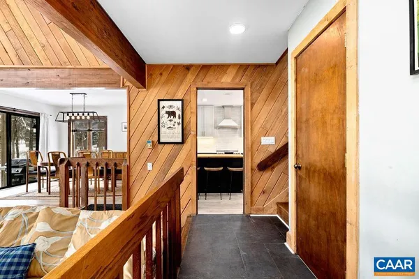 a view of a dining room with furniture wooden floor and chandelier
