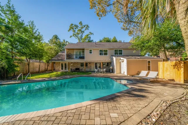 a kitchen with stainless steel appliances a refrigerator and a stove