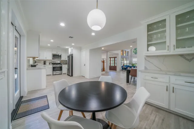 a living room with furniture ceiling fan and a rug