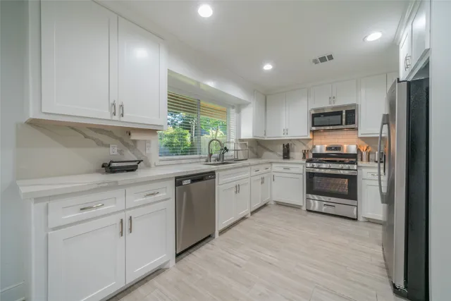 a dining room with furniture and a chandelier