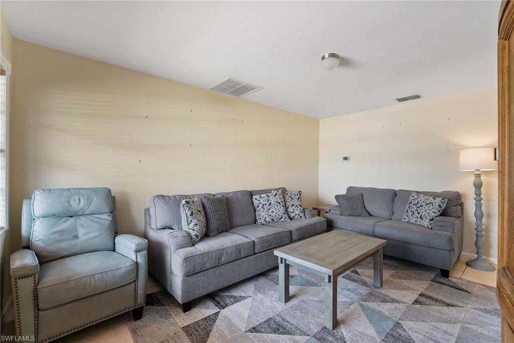 18565 Sebring Road Fort Myers, FL 33967 - Photo 4 of 23 a living room with furniture and a couch