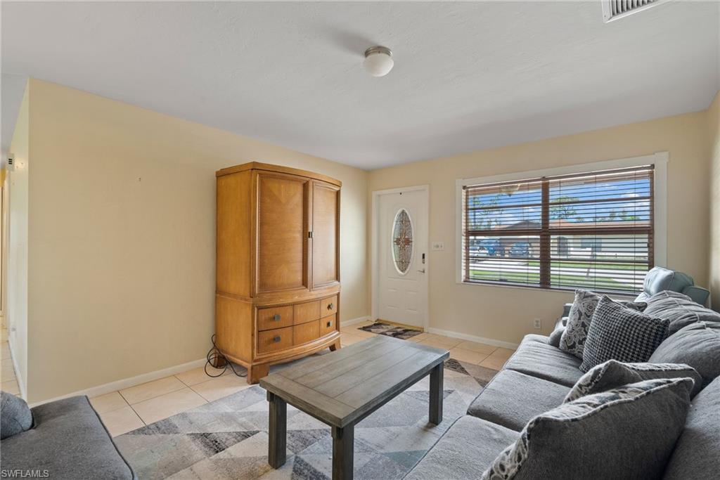 18565 Sebring Road Fort Myers, FL 33967 - Photo 6 of 23 a living room with furniture and a window