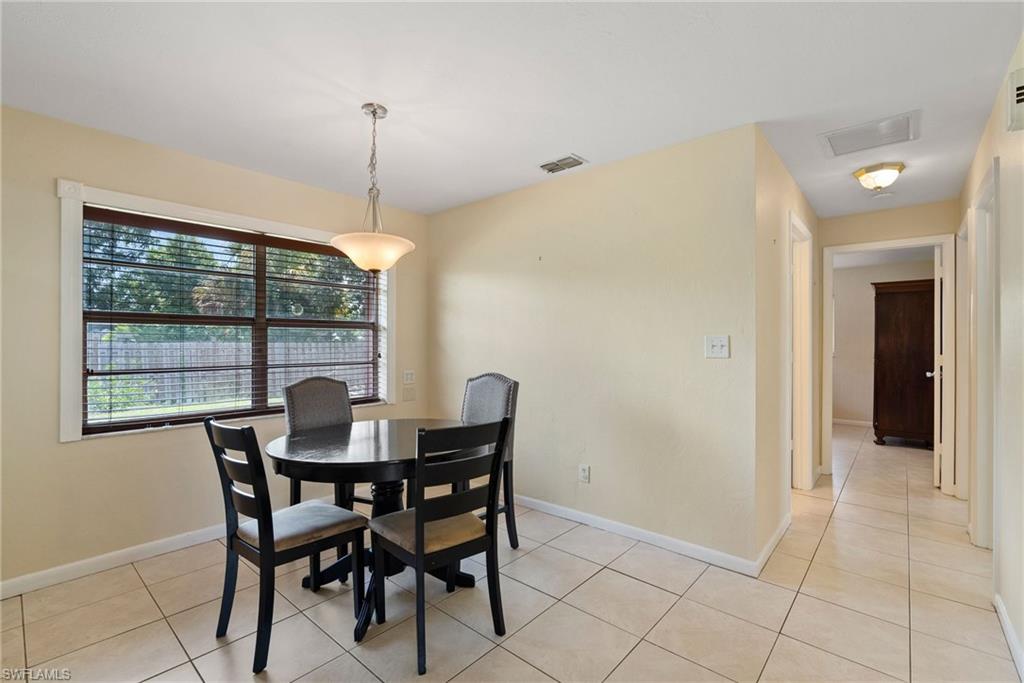 18565 Sebring Road Fort Myers, FL 33967 - Photo 7 of 23 a dining room with furniture and window