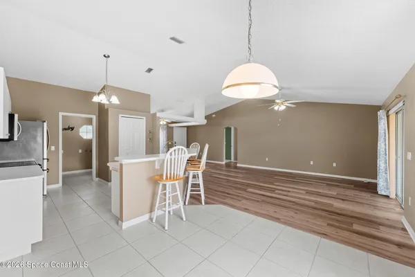 a view of a dining room with furniture