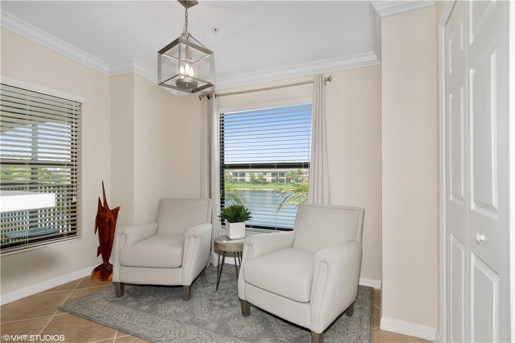 9529 Avellino Way, Unit 2823 Naples, FL 34113 - Photo 17 of 25 a living room with furniture and a window