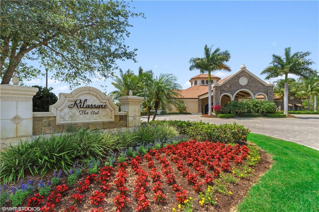 9529 Avellino Way, Unit 2823 Naples, FL 34113 - Photo 18 of 25 a front view of a house with garden