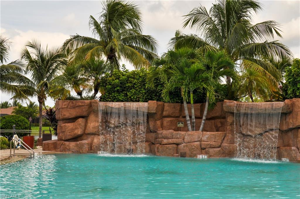 9529 Avellino Way, Unit 2823 Naples, FL 34113 - Photo 20 of 25 a garden view with tall trees