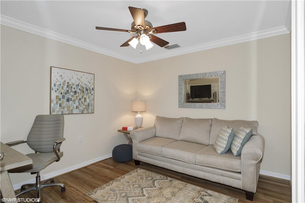 9529 Avellino Way, Unit 2823 Naples, FL 34113 - Photo 10 of 25 a living room with furniture and a ceiling fan