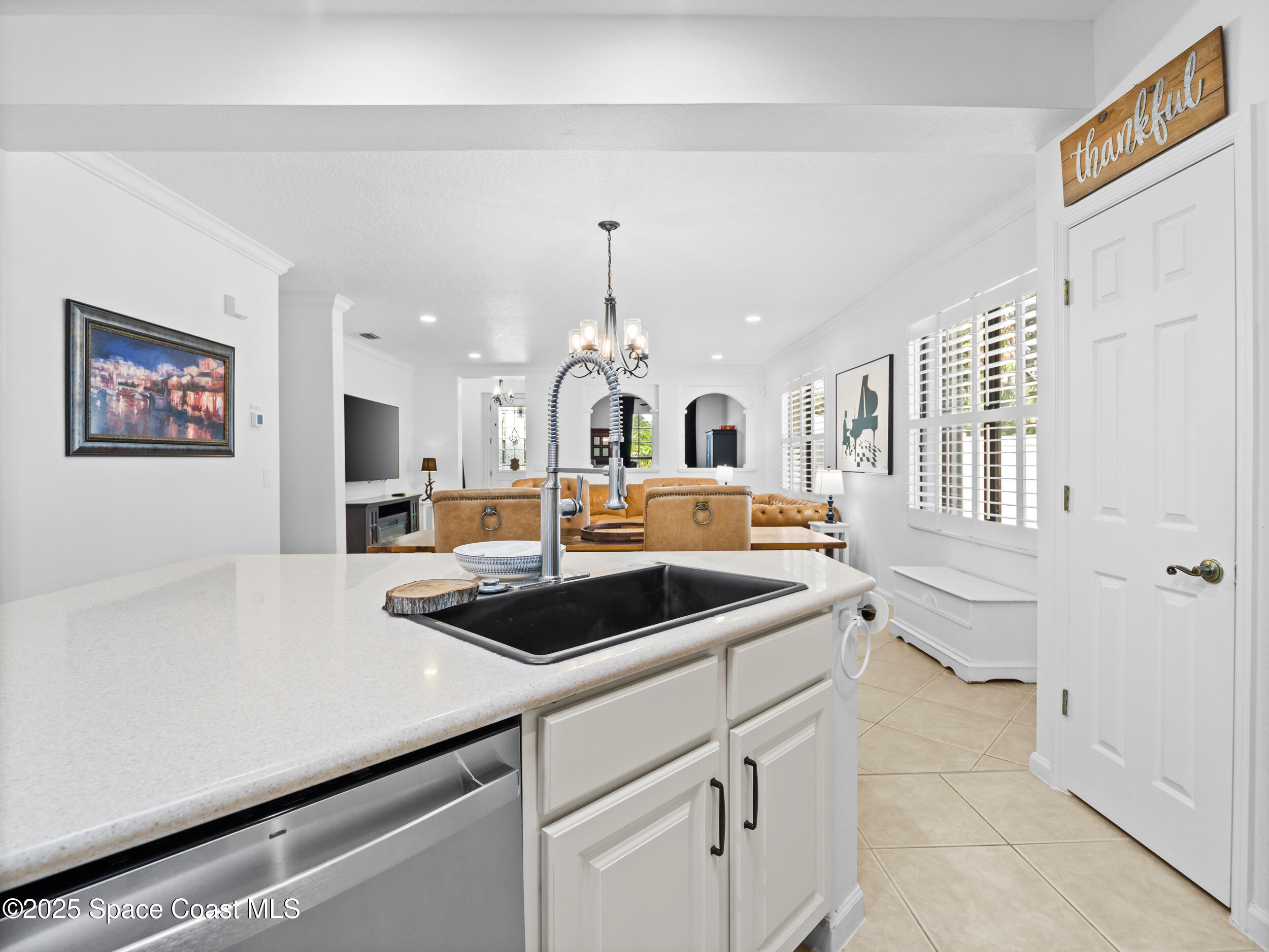 1214 Bolle Circle Rockledge, FL 32955 - Photo 14 of 27 a kitchen with a sink and a stove top oven