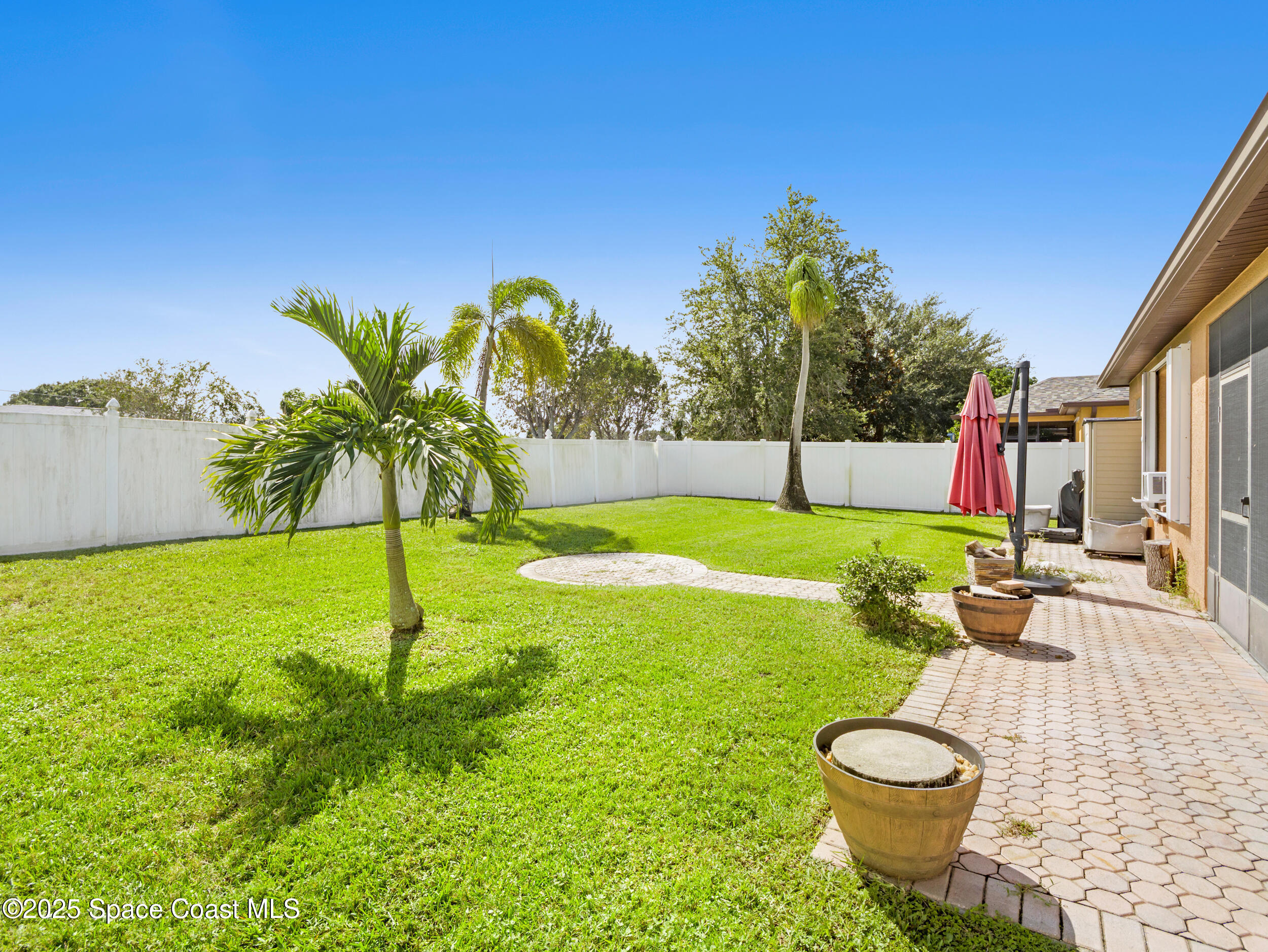 1214 Bolle Circle Rockledge, FL 32955 - Photo 25 of 27 a view of an house with backyard space and sitting area