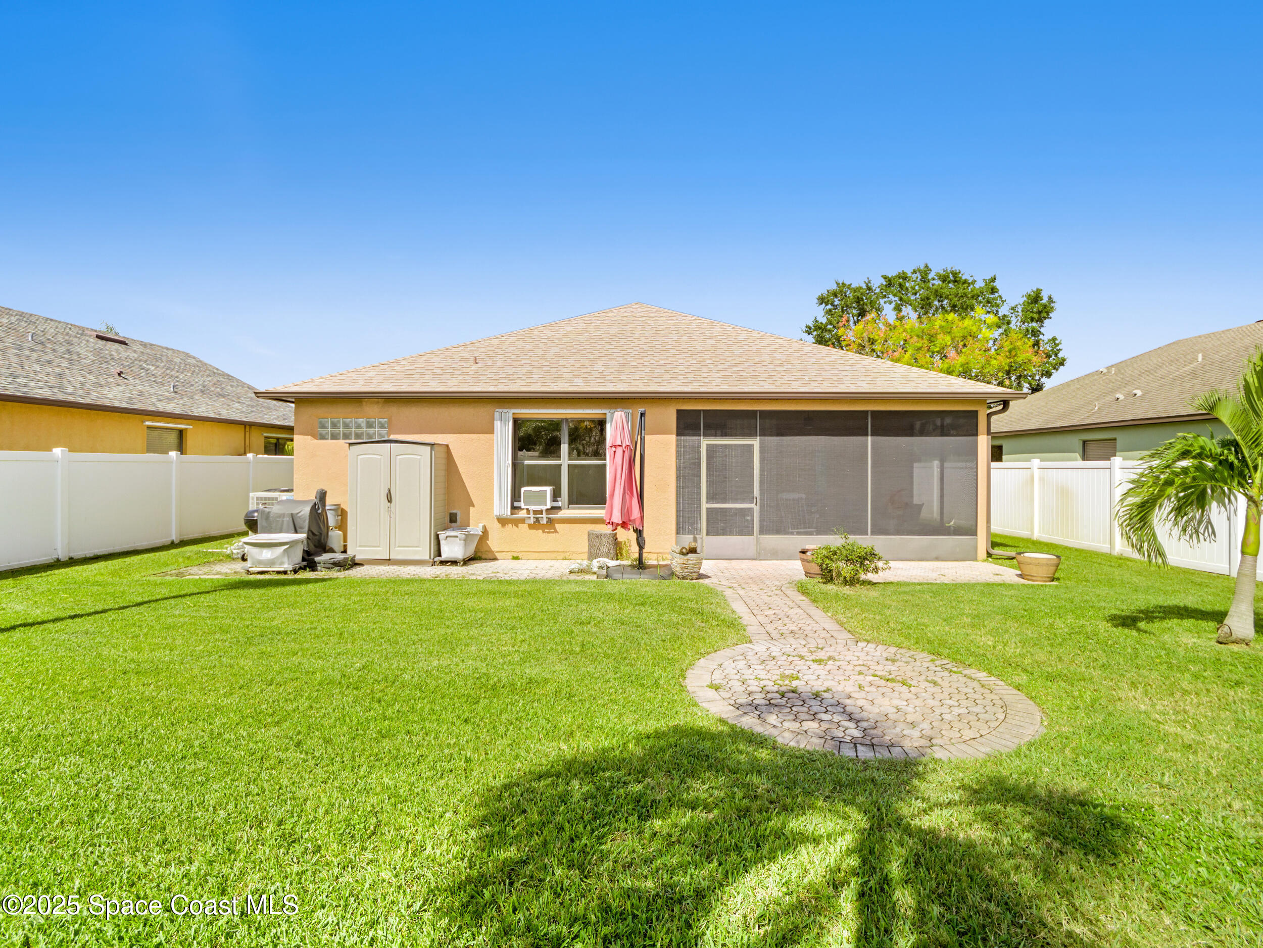 1214 Bolle Circle Rockledge, FL 32955 - Photo 26 of 27 a view of a house with a backyard