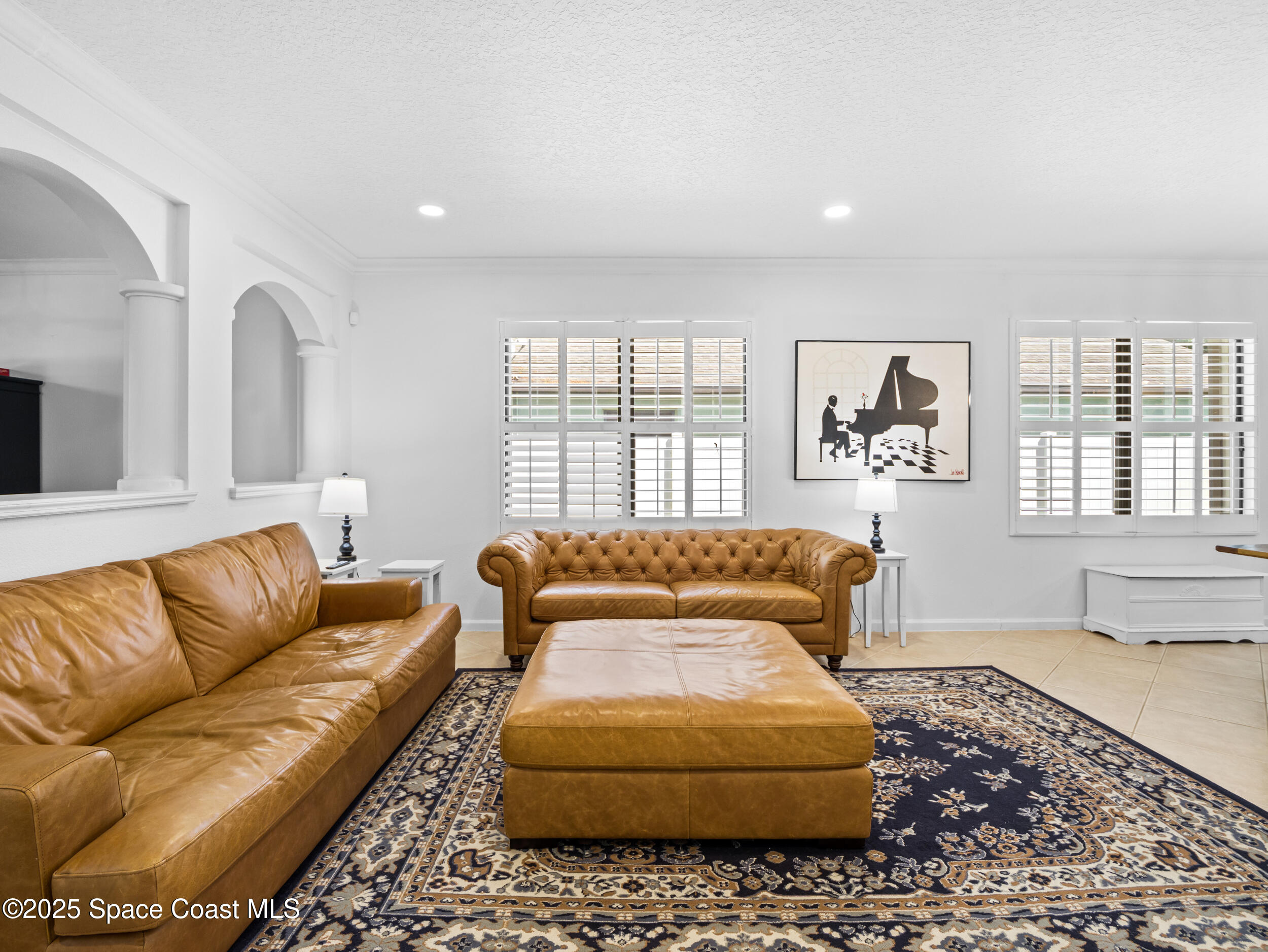 1214 Bolle Circle Rockledge, FL 32955 - Photo 7 of 27 a living room with furniture and a large window