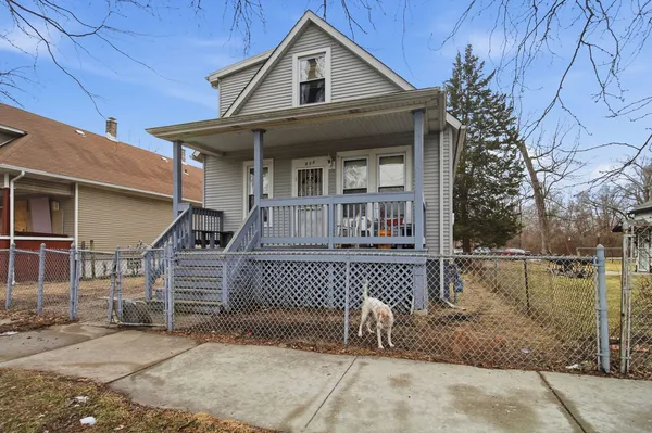 a front view of a house with garage