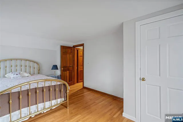 a bedroom with a bed and a table