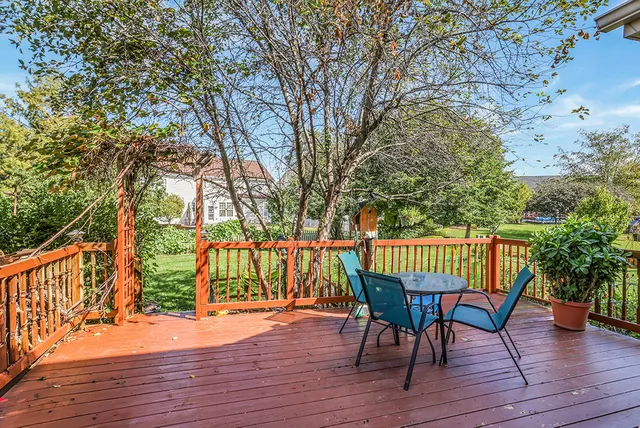 a view of balcony with wooden floor and outdoor seating