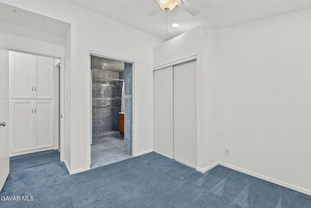 an empty room with closet area