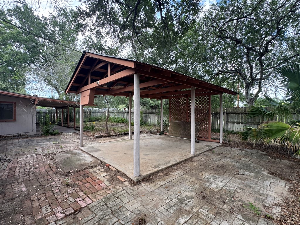 409 Taylor Road Falfurrias, TX 78355 - Photo 3 of 13 a backyard of a house with table and chairs