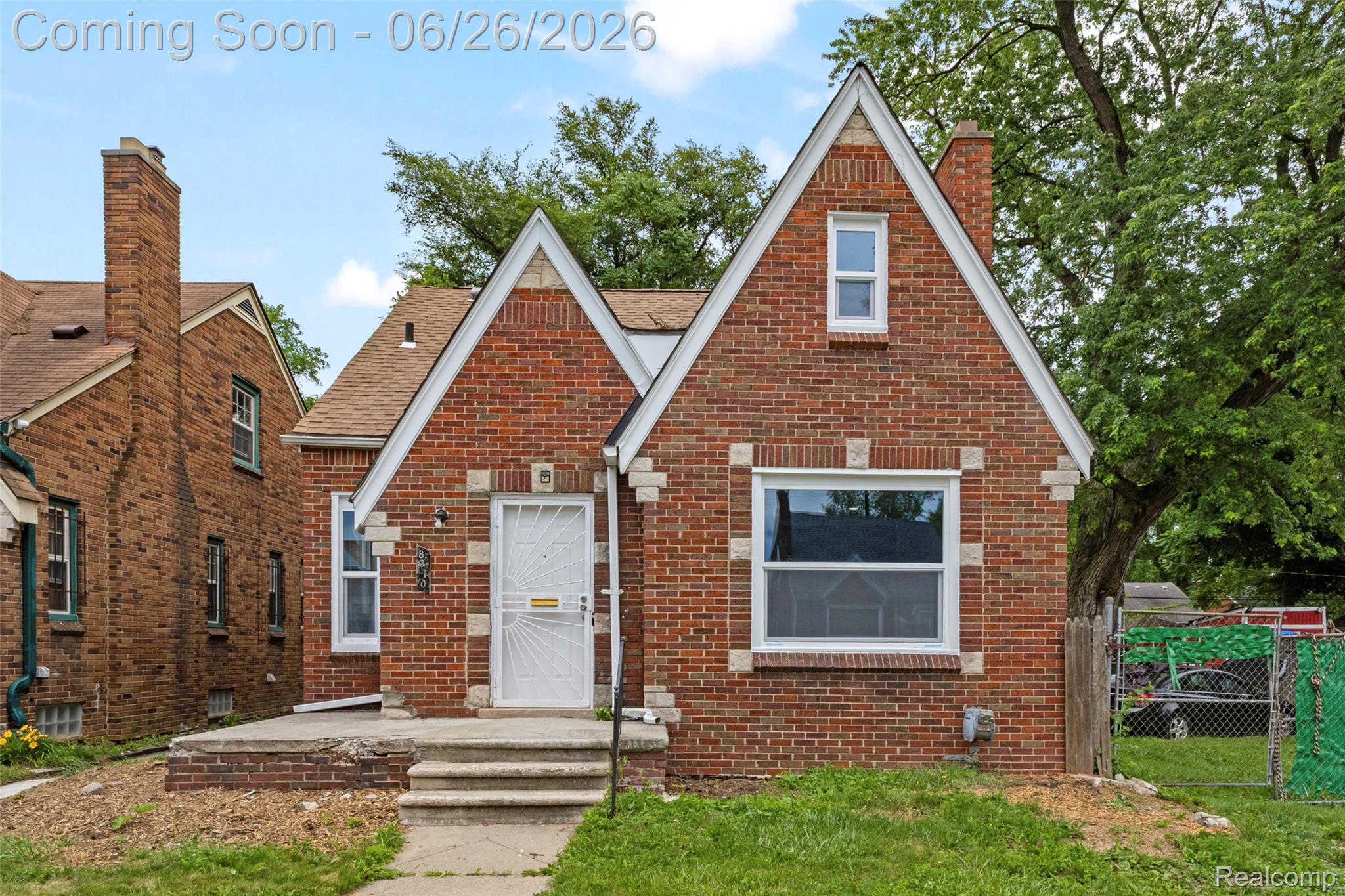 8310 Whitcomb Detroit, MI 48228 - Photo 2 of 26 Brick exterior featuring stone accents and a gabled roofline