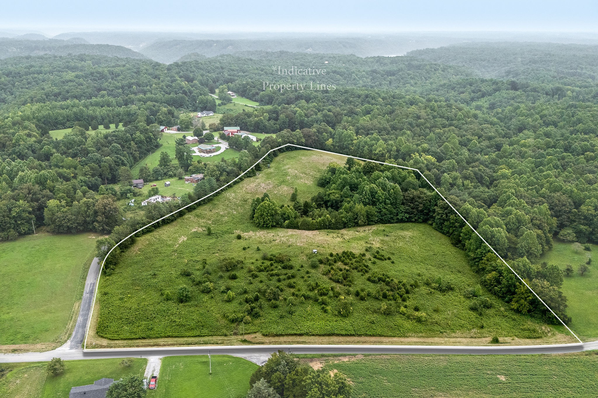 0 Four 4 Seasons Road Smithville, TN 37166 - Photo 1 of 17 a view of a green yard with a lush green forest