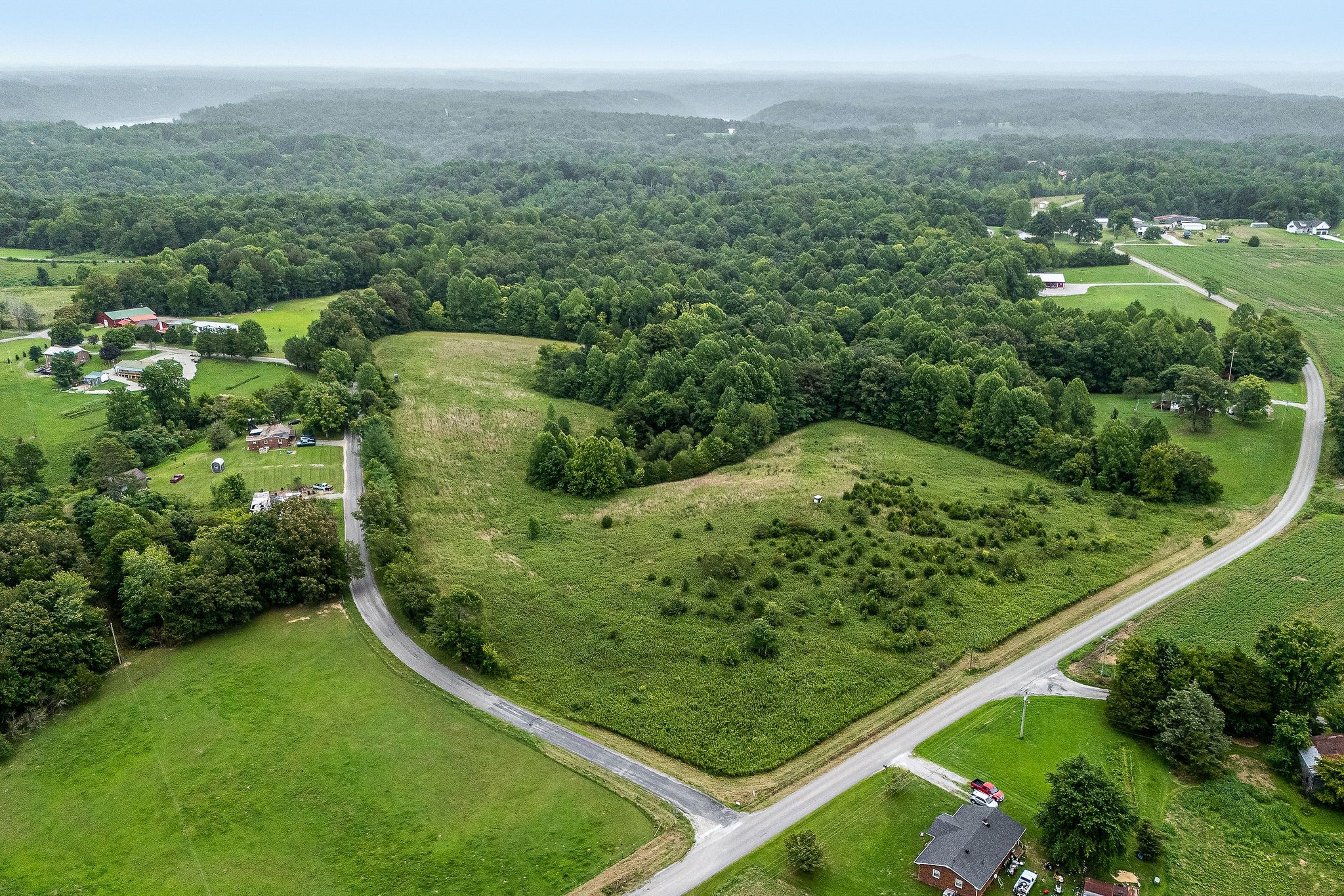 0 Four 4 Seasons Road Smithville, TN 37166 - Photo 12 of 17 a view of a green field with lots of bushes