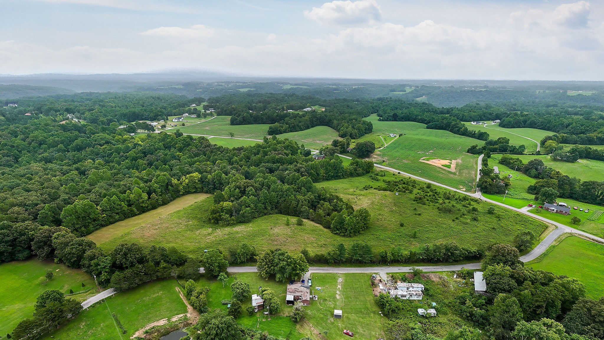 0 Four 4 Seasons Road Smithville, TN 37166 - Photo 9 of 17 a view of a green yard with large trees