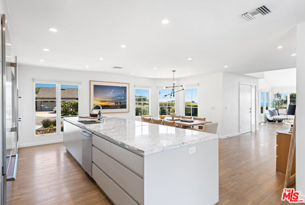 20413 Roca Chica Drive Malibu, CA 90265 - Photo 12 of 27 a large kitchen with stainless steel appliances lots of counter top space