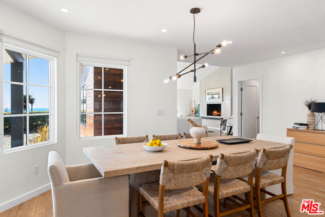 20413 Roca Chica Drive Malibu, CA 90265 - Photo 13 of 27 a kitchen view with dining table and chairs
