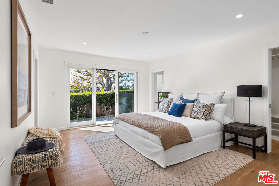 20413 Roca Chica Drive Malibu, CA 90265 - Photo 17 of 27 a bedroom with a bed and a window